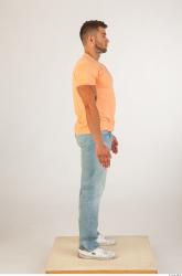 Whole body orange tshirt light blue jeans of Harold